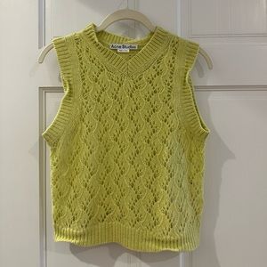 Acne Studios yellow wool sweater vest.